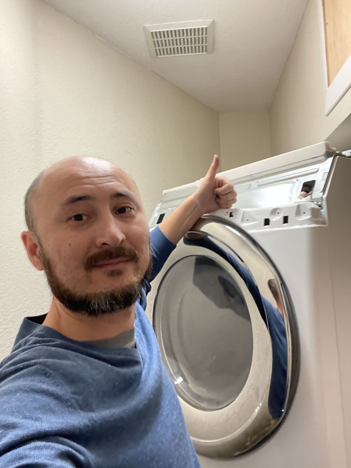 Technician after completed dryer repair